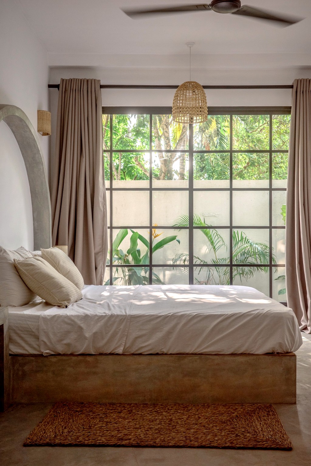 Casa bedroom · platform bed, jute rug, garden window