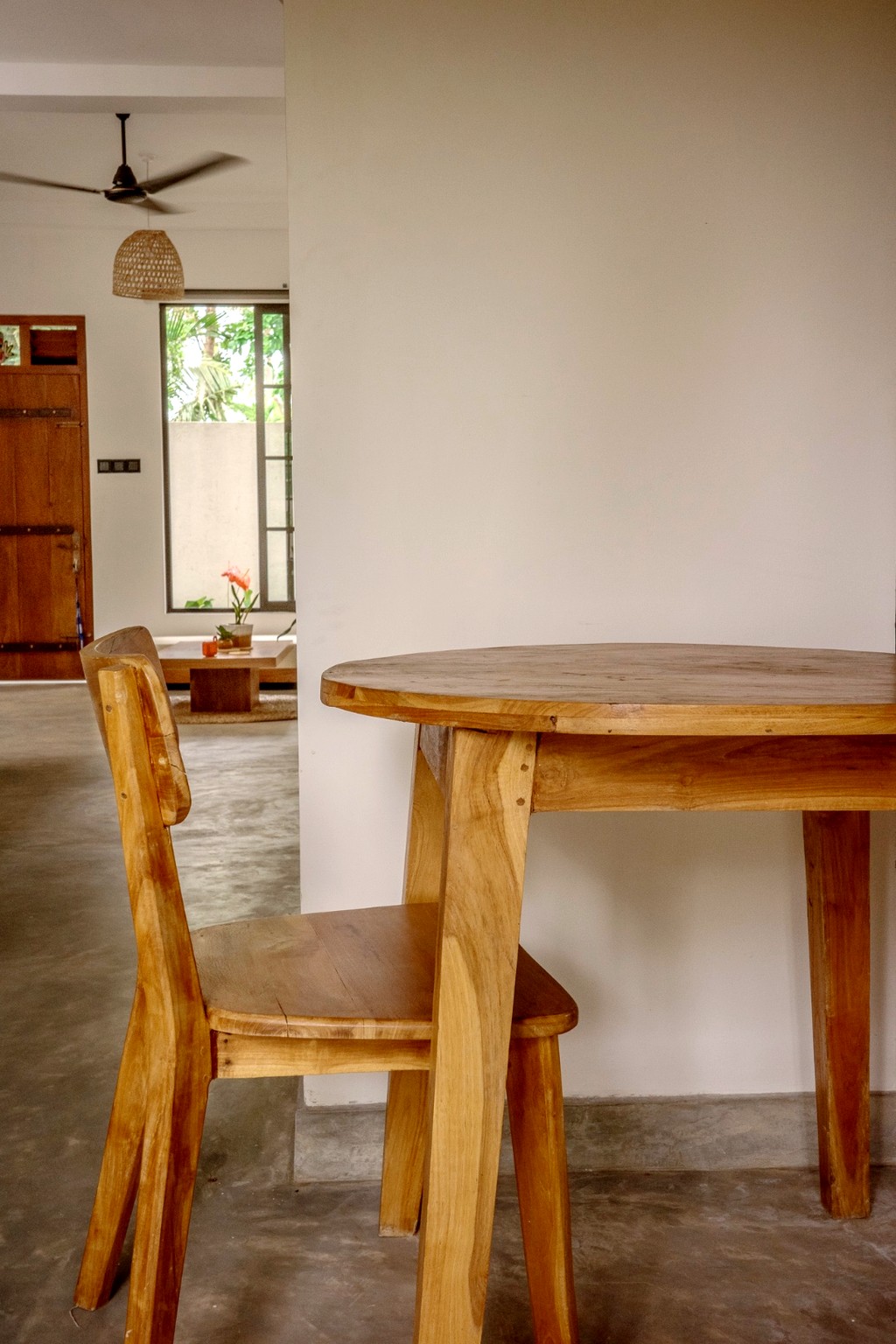 Casa dining · round table seen through the archway to the living room