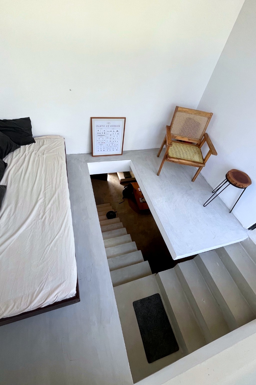 Casa loft · vintage armchair above the open stairwell