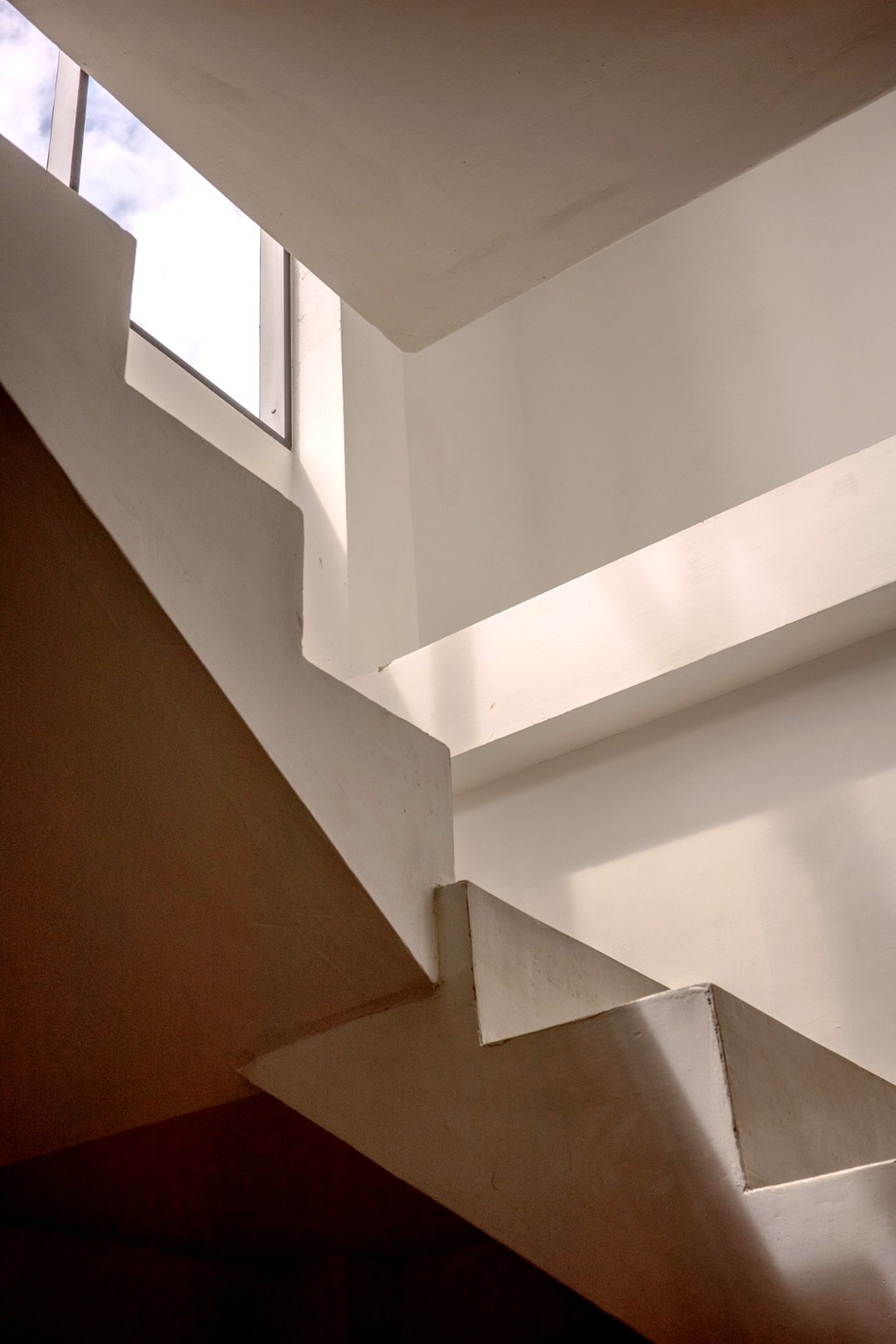Casa cast-concrete staircase in light and shadow
