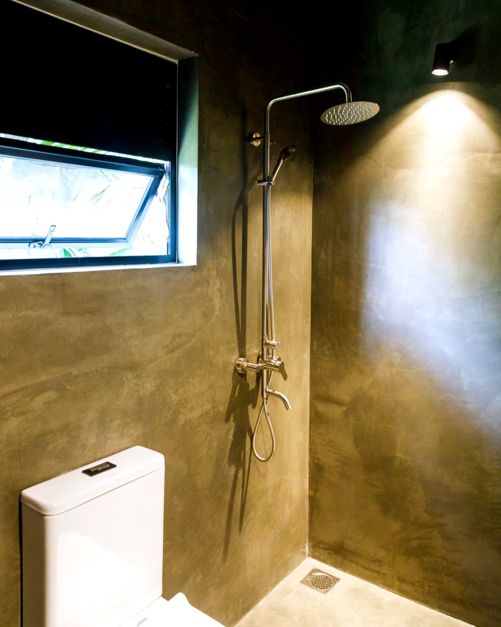 Safiya bathroom · concrete walk-in rain shower