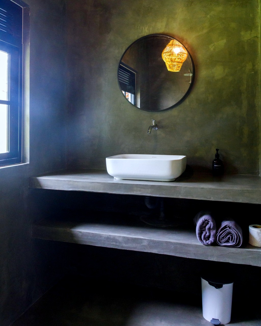 Safiya bathroom · vessel sink, round mirror, rolled towels