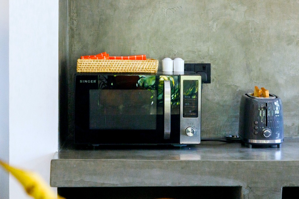 Safiya kitchen · toaster and kettle on the concrete counter