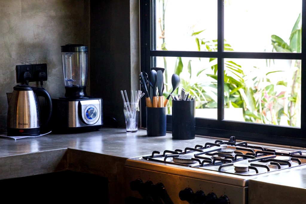 Safiya kitchen · concrete counter with the stovetop