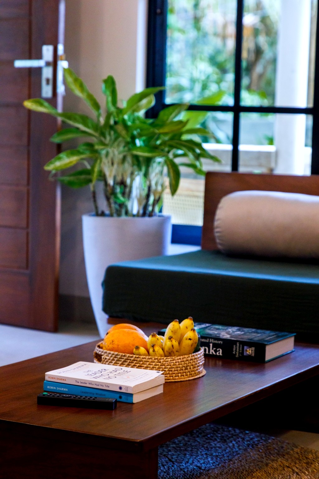 Safiya living room · fruit bowl and books on the coffee table