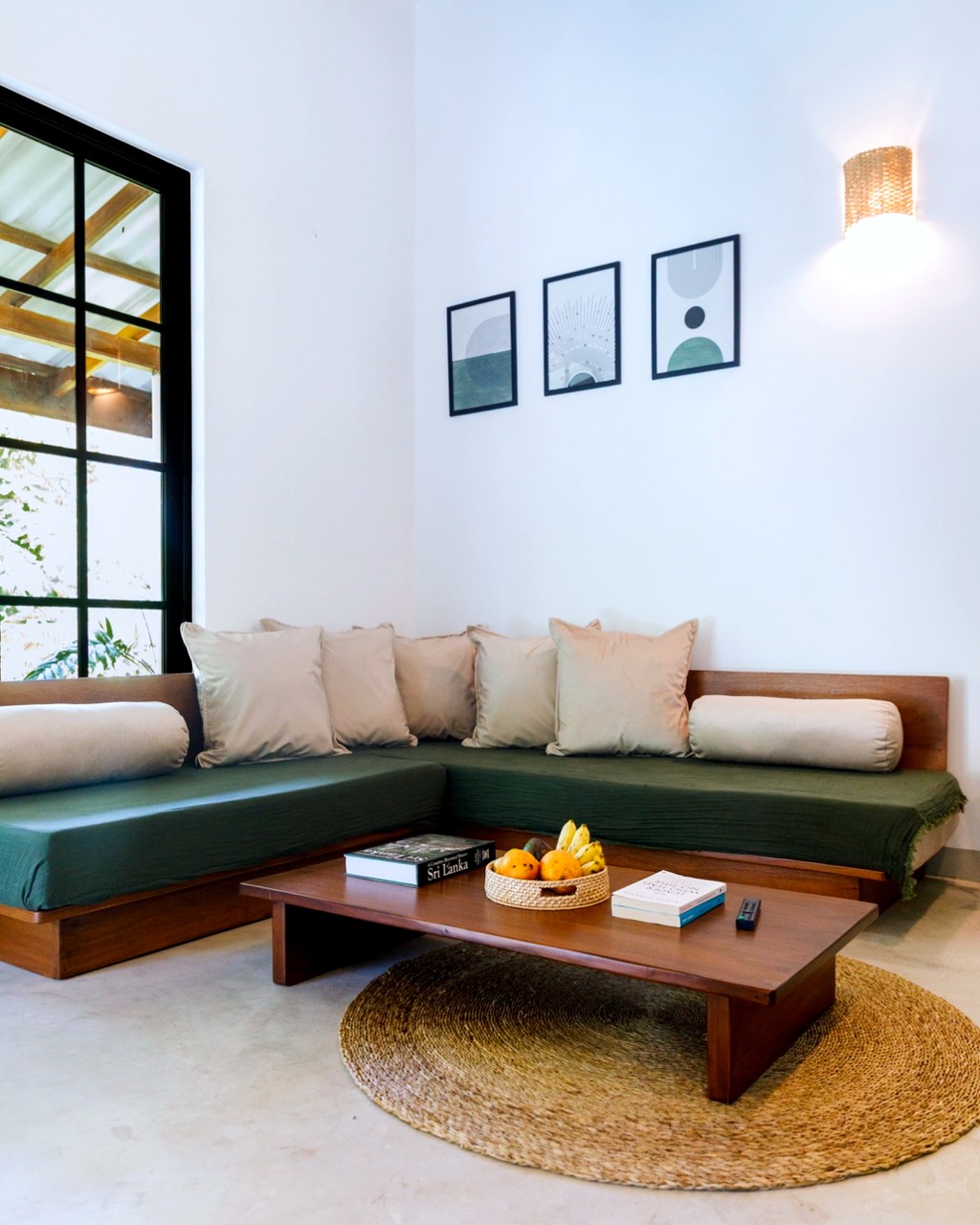 Safiya living room · full L-shaped daybed, jute rug, framed art