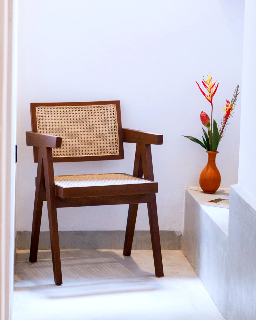 Safiya bedroom two · cane armchair in the corner nook