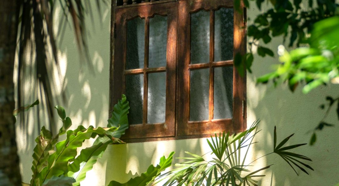 A carved window, the making of the new houses